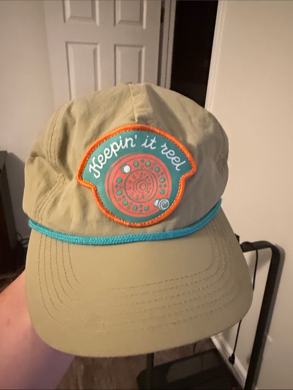 Tan Fishing Cap with Teal Trim and 'Keepin' it reel' Patch